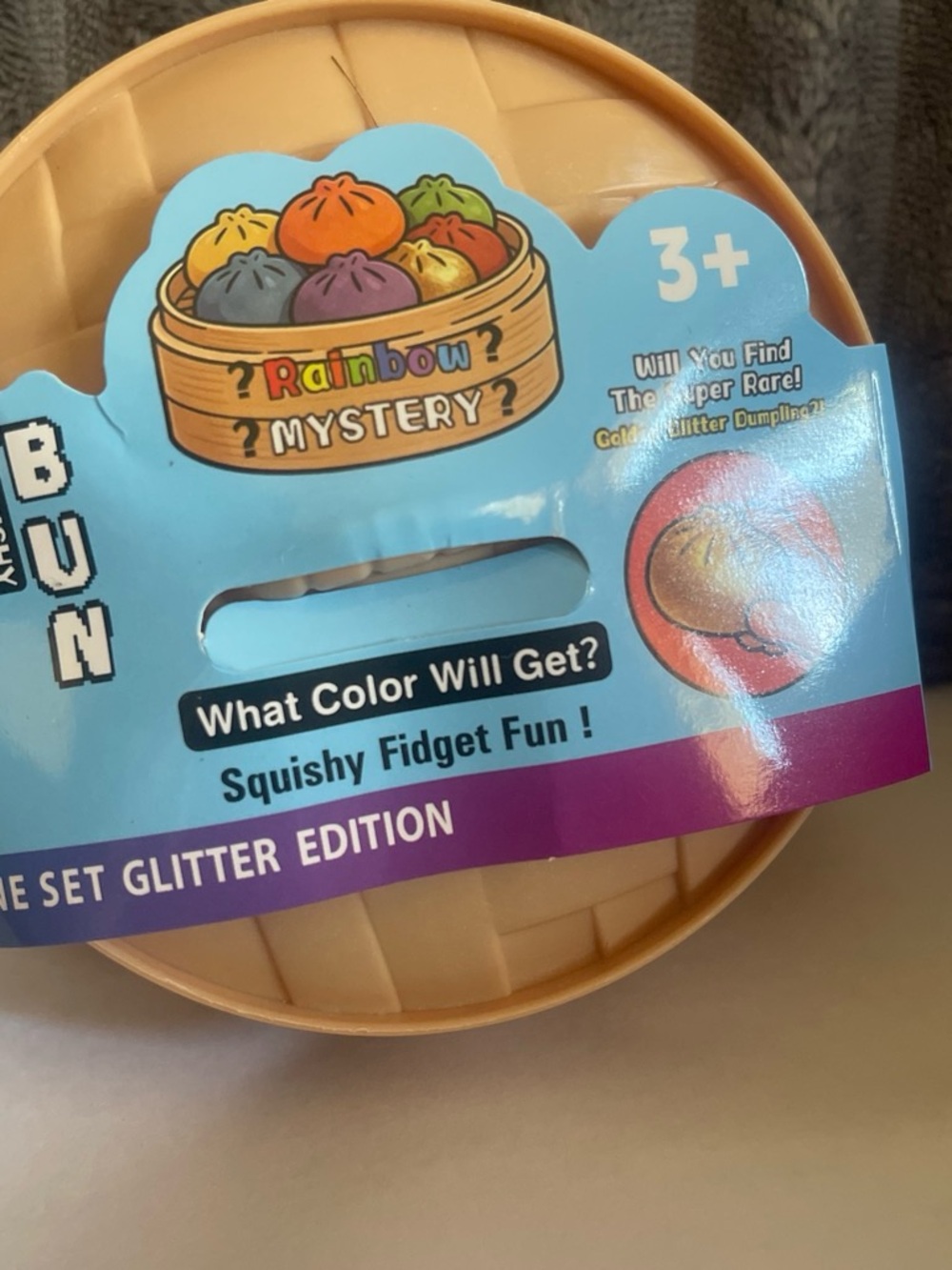 Rainbow Mystery Glitter Dumpling Squishy Fidget Toy - Blue Packaging